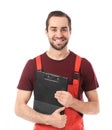 Young car mechanic with clipboard on white background Royalty Free Stock Photo
