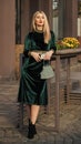 Young and carefree. girl care gem stone handbag or purse. glam clutch accessory. elegant woman in green velour dress