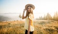 Young carefree woman enjoying nature and sunlight in straw hat Royalty Free Stock Photo