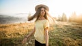 Young carefree woman enjoying nature and sunlight in straw hat Royalty Free Stock Photo