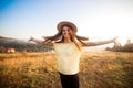 Young carefree woman enjoying nature and sunlight in straw hat Royalty Free Stock Photo