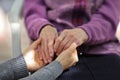 Young caregiver holding seniors hand. Elderly concept Royalty Free Stock Photo