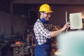 Carpenter doing his job in carpentry workshop. Royalty Free Stock Photo