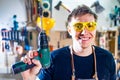 Young carpenter sawing board with circular saw Royalty Free Stock Photo