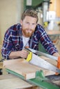 young carpenter sawing wood Royalty Free Stock Photo