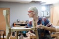 young carpenter women using measuring tape looking wood size at workspace. craftsman profession in wood factory Royalty Free Stock Photo