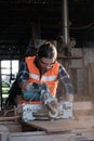 A young carpenter is working to order in his own wood factory. With peace of mind by using hand tools including saws, wood planers Royalty Free Stock Photo