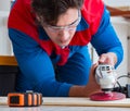 Young carpenter working with wooden planks Royalty Free Stock Photo