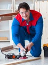 Young carpenter working with wooden planks Royalty Free Stock Photo