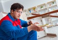 Young carpenter working with wooden planks Royalty Free Stock Photo