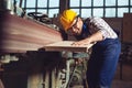 Carpenter working on woodworking machines in carpentry shop Royalty Free Stock Photo