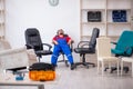 Young male carpenter working at workshop Royalty Free Stock Photo