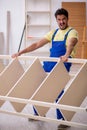 Young male carpenter working at home Royalty Free Stock Photo