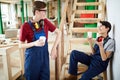 Young carpentry workers chatting during break