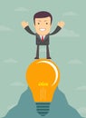 Young cartoon businessman on light bulb