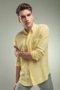 Young casual fashion man holding his right arm Royalty Free Stock Photo