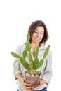 Young casual girl or woman with cactus in flowerpot