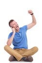 Young casual man cheering on his phone Royalty Free Stock Photo