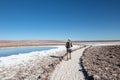 Young casual man hiking on the trail atlagunas Escondidas of Baltinache in Atacama Desert, Chile, South America