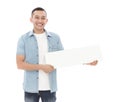 Young casual man holding blank white board Royalty Free Stock Photo