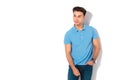 Young casual man in polo shirt looking to side Royalty Free Stock Photo