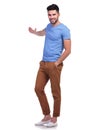 Young casual man presenting something Royalty Free Stock Photo