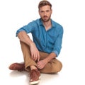 Young casual man resting on the floor Royalty Free Stock Photo