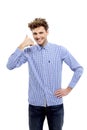 Young casual man showing call me gesture