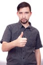 Young casual man showing the thumb up gesture Royalty Free Stock Photo