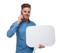 Young casual man with speech bubble speakng on the phone Royalty Free Stock Photo