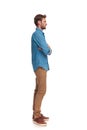Young casual man standing in line with hands crossed Royalty Free Stock Photo