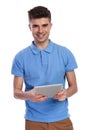 Young casual man with a tablet pad computer Royalty Free Stock Photo
