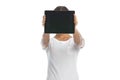 Young casual woman covering her face with tablet Royalty Free Stock Photo