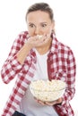 Young casual woman eating popcorn. Royalty Free Stock Photo