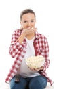 Young casual woman eating popcorn. Royalty Free Stock Photo