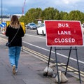 Young Casually Dressed Woman Walking Alone Along Waterloo Bridge London