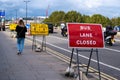 Young Casually Dressed Woman Walking Alone Along Waterloo Bridge London