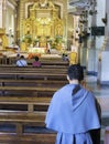 A young Catholic monk prays at Cebu Metropolitan Cathedral,during an afternoon visit