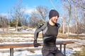 Youn caucasian man training in winter park