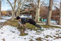 Youn caucasian man training in winter park
