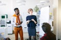 Young Caucasian attractive coach in glasses is giving course for co-workers