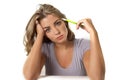 Young Caucasian attractive student girl or working woman blond hair blue eyes sitting at computer desk sad in stress looking tired Royalty Free Stock Photo