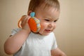 Young caucasian baby girl talking on a toy cell phone copy space, close up portrait Royalty Free Stock Photo