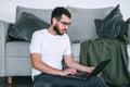 Young caucasian bearded businessman using laptop computer. Work at home Royalty Free Stock Photo