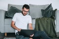 Young caucasian bearded businessman using laptop computer. Work at home Royalty Free Stock Photo