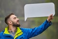 Caucasian man with blank sheet of paper