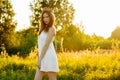 Young beautiful girl in white dress