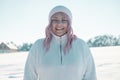 Young Caucasian Beautiful pink hair woman smile at camera taking selfie photo or video call in winter snow forest Royalty Free Stock Photo