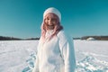 Young Caucasian Beautiful pink hair woman smile at camera taking selfie photo or video call in winter snow forest Royalty Free Stock Photo