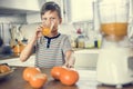 Young Caucasian boy drinking orange juice Royalty Free Stock Photo